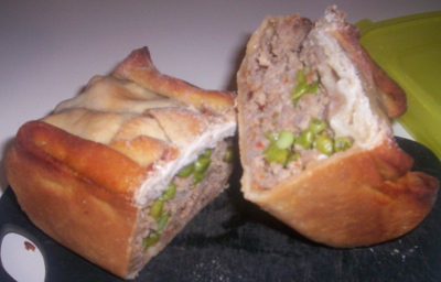 This is the mini-loaf pan calzone to be eaten cold. Once cold, it becomes hand-held food because the innards hold their shape better. It's just like winter solstice pie that way.